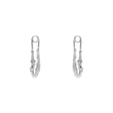 Paola Vilas earring in sterling silver featuring a safety pin and female body