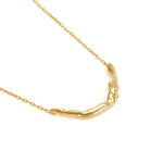 Sterling silver necklace with 18k gold plating by Paola Vilas featuring a small female body