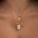 Model wearing large ant pendant on sterling silver chain with 18k gold plating