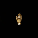 18k gold hand piercing adorned with a diamond