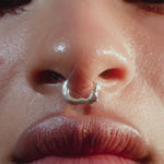 Video of a model wearing a sterling silver piercing of a female body