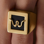 Model wearing Paola Vilas chevalier ring in sterling silver with 18k gold plating featuring an abstract breasts