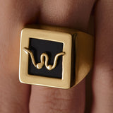 Model wearing Paola Vilas chevalier ring in sterling silver with 18k gold plating featuring an abstract breasts