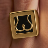Model wearing Paola Vilas chevalier ring in sterling silver with 18k gold plating featuring an abstract butt