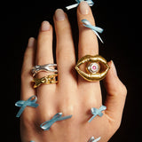 Model wearing sterling silver rings of a mouth and female bodies