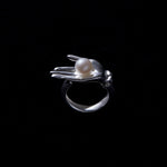 Sculptural hand ring in sterling silver with button pearl